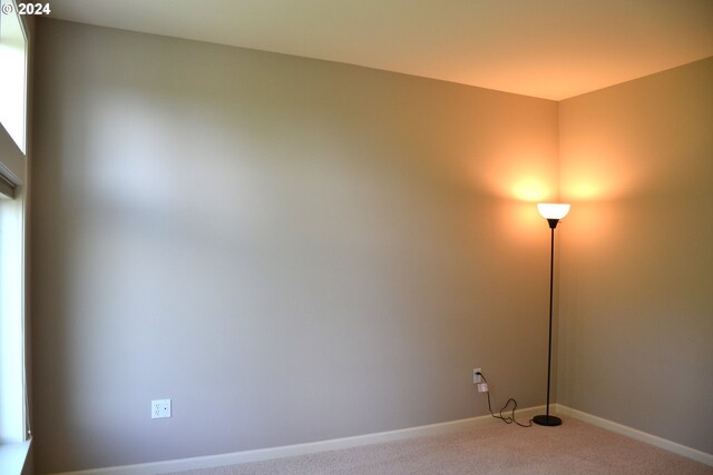 empty room with light colored carpet