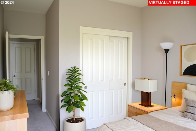 carpeted bedroom with a closet