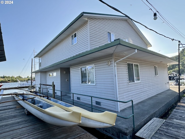 view of side of property featuring a wooden deck