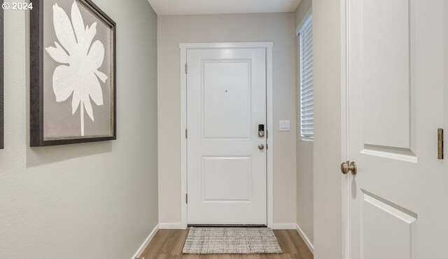 doorway to outside with hardwood / wood-style flooring