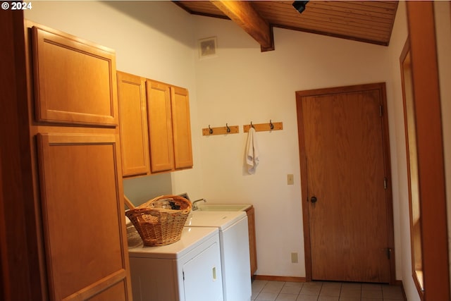 washroom featuring light tile patterned floors, wooden ceiling, cabinets, sink, and washer and dryer