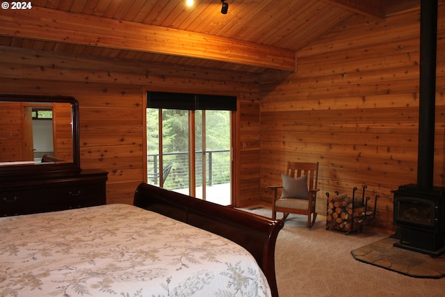 bedroom featuring lofted ceiling with beams, a wood stove, access to exterior, wooden ceiling, and carpet