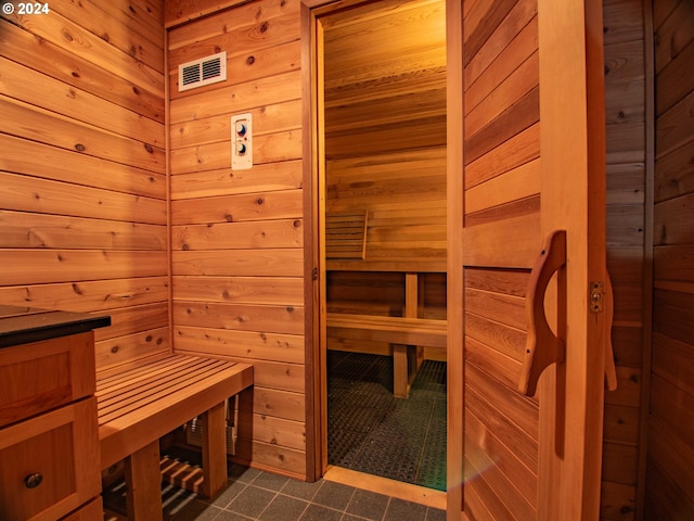 view of sauna / steam room featuring wooden walls