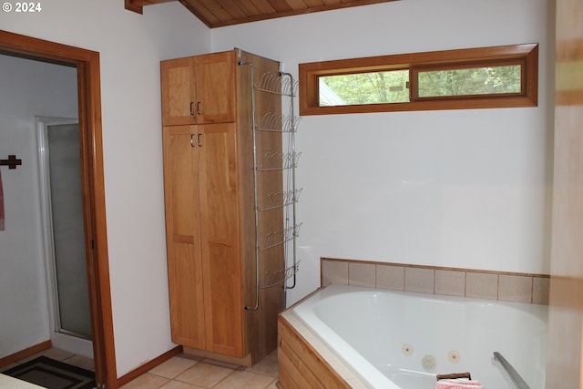 bathroom with tile patterned floors and separate shower and tub