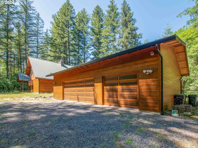 garage featuring wood walls