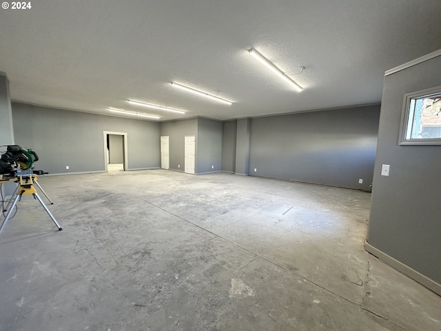 spare room with concrete floors and a textured ceiling