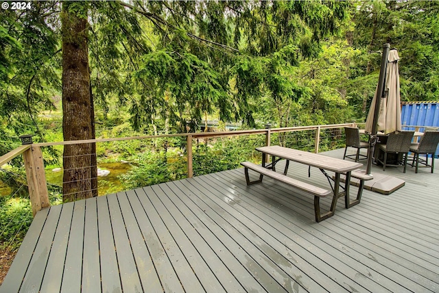 wooden deck featuring outdoor dining space