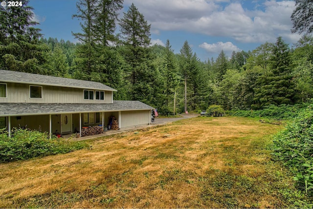 view of yard featuring a view of trees