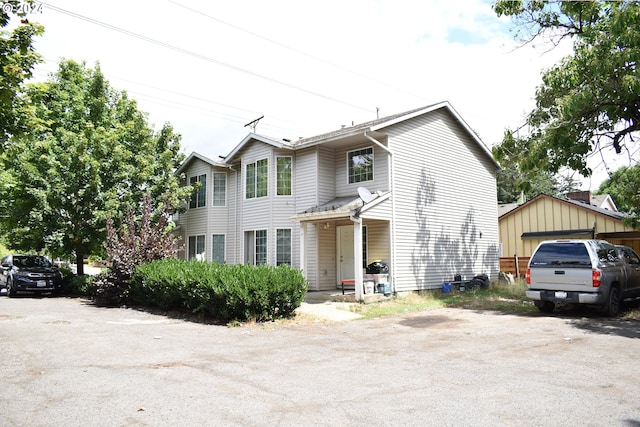 view of front facade with a garage and an outdoor structure