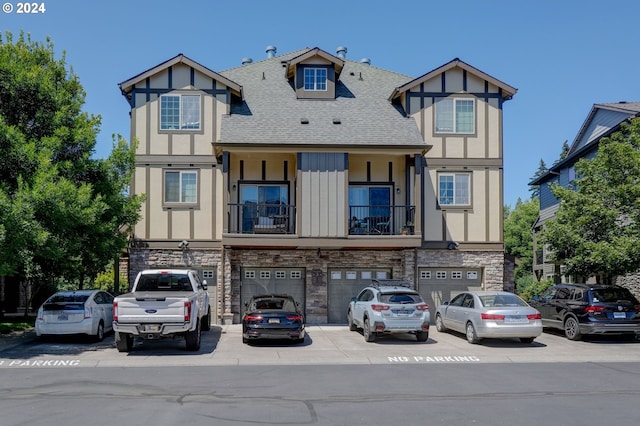 tudor home featuring a garage