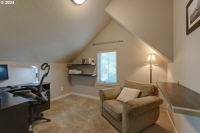carpeted office with lofted ceiling, baseboards, and a textured ceiling
