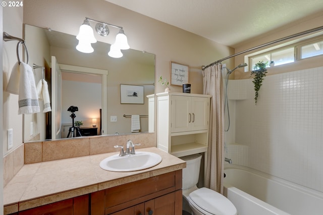 full bathroom with shower / tub combo, vanity, a notable chandelier, and toilet