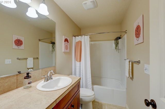 full bath featuring shower / bath combo, toilet, vanity, and tile patterned floors