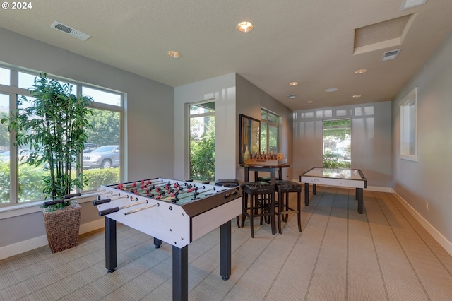 recreation room with visible vents, baseboards, and recessed lighting