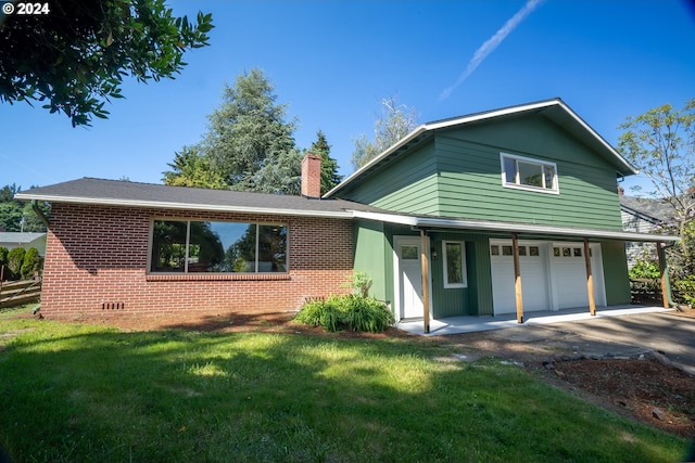 view of front facade with a garage, covered porch, and a front lawn