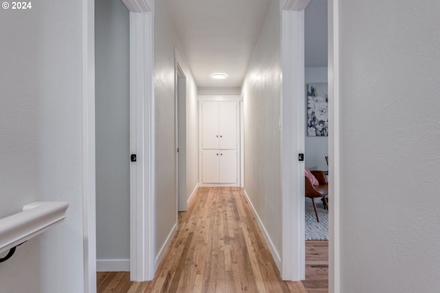 corridor featuring light hardwood / wood-style floors