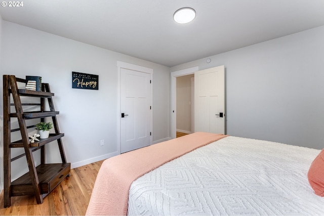 bedroom with light hardwood / wood-style floors