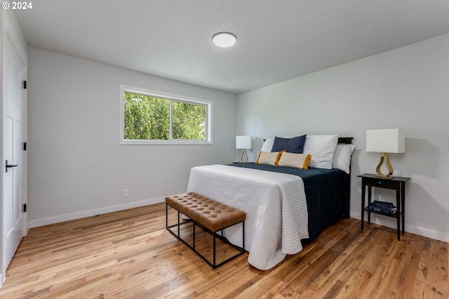 bedroom with light hardwood / wood-style floors