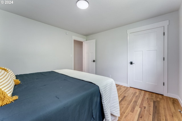 bedroom with wood-type flooring