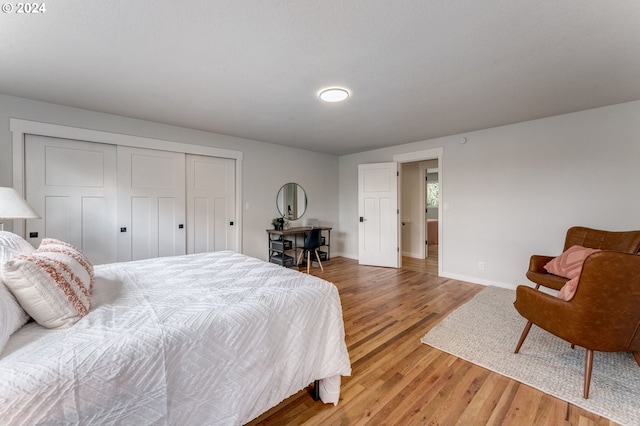 bedroom featuring a closet and wood-type flooring