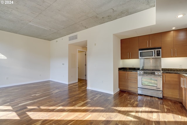 kitchen featuring dark wood-type flooring and stainless steel appliances