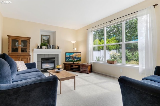 carpeted living room featuring a fireplace