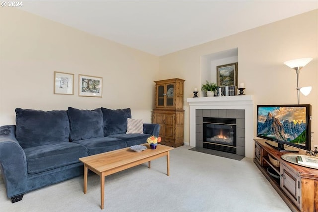 living room with light carpet and a fireplace