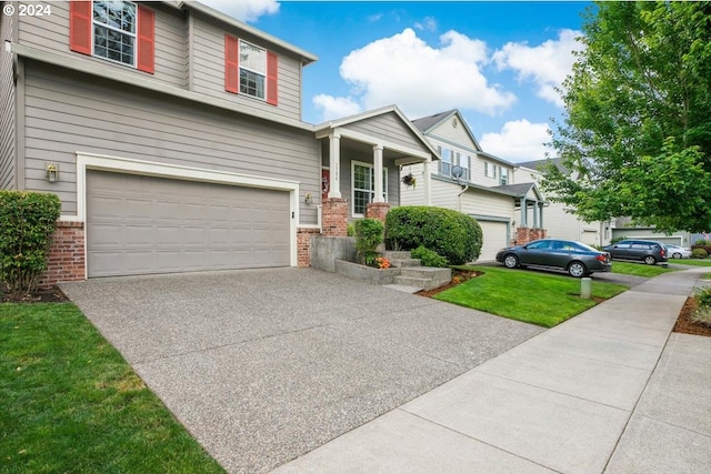 view of front of house featuring a front yard and a garage