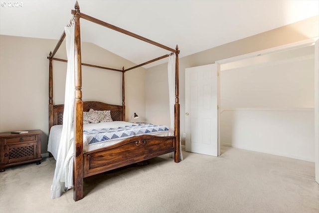 bedroom with carpet floors and vaulted ceiling