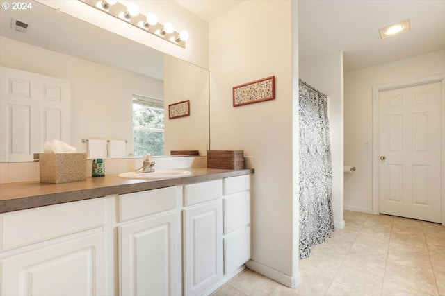 bathroom featuring tile patterned floors and vanity