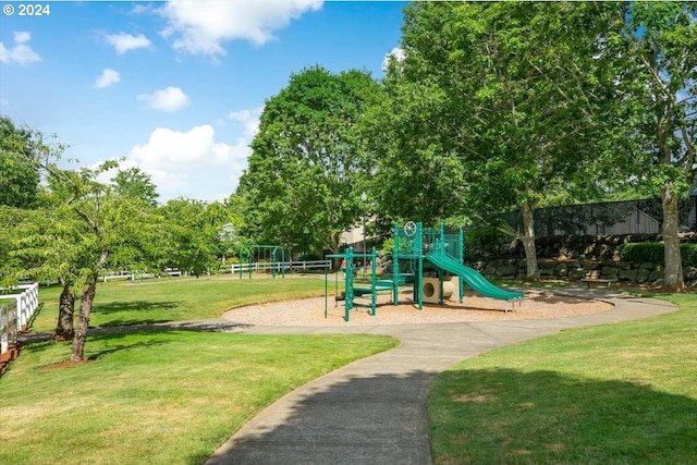 view of jungle gym featuring a lawn