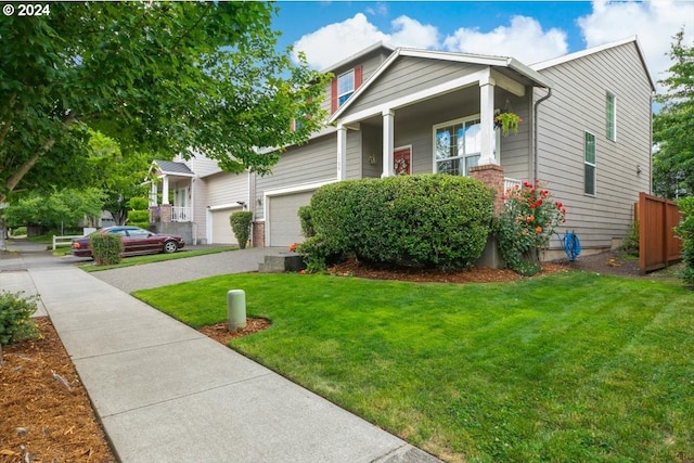 view of front of property featuring a front yard and a garage