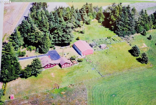 birds eye view of property with a rural view