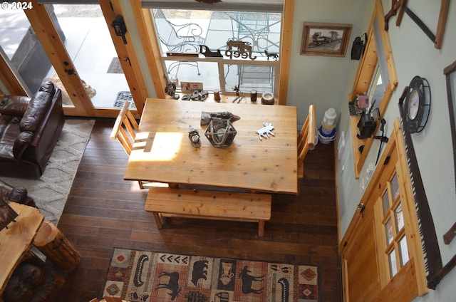 dining space featuring dark wood-type flooring