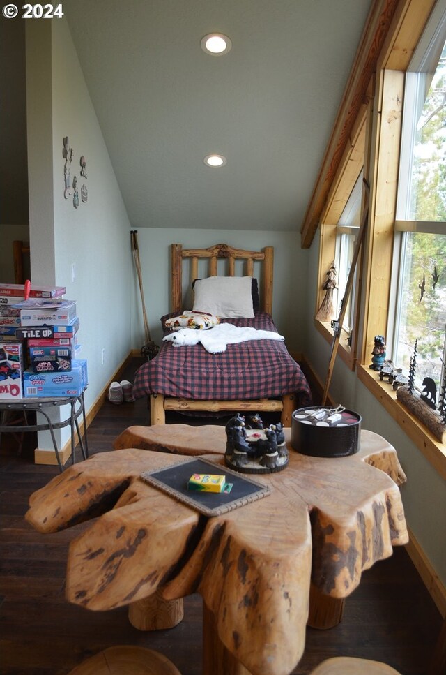 bedroom featuring wood-type flooring and vaulted ceiling