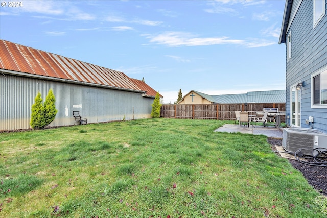 view of yard with central AC unit