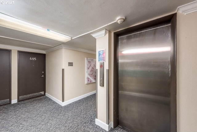 interior space featuring crown molding, a textured ceiling, and elevator