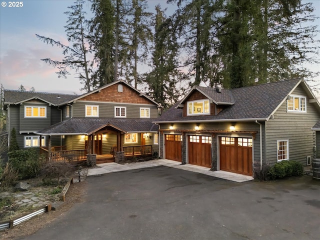 craftsman-style house with a garage and a porch