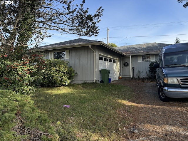 view of home's exterior with a lawn and a garage