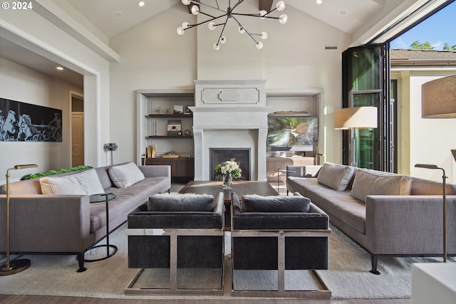 living room featuring a notable chandelier, hardwood / wood-style floors, and high vaulted ceiling