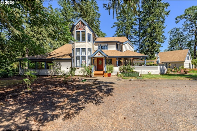 victorian house featuring a porch