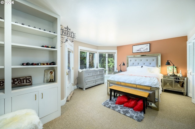 bedroom featuring light carpet