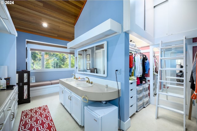 bathroom featuring wood ceiling, vanity, and high vaulted ceiling