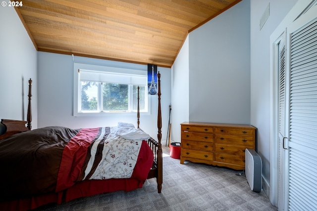 bedroom featuring wood ceiling and carpet floors