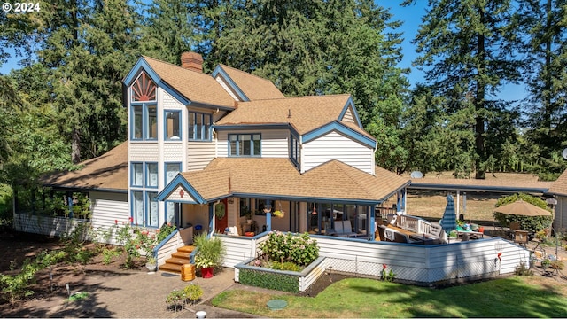 rear view of property with a deck