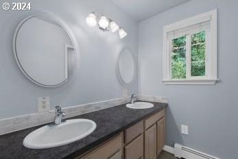 bathroom featuring vanity and a baseboard heating unit