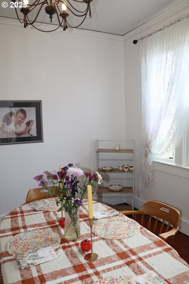 530 SE Marlin Ave, Warrenton, OR 97146 - dining area featuring wood finished floors and an inviting chandelier