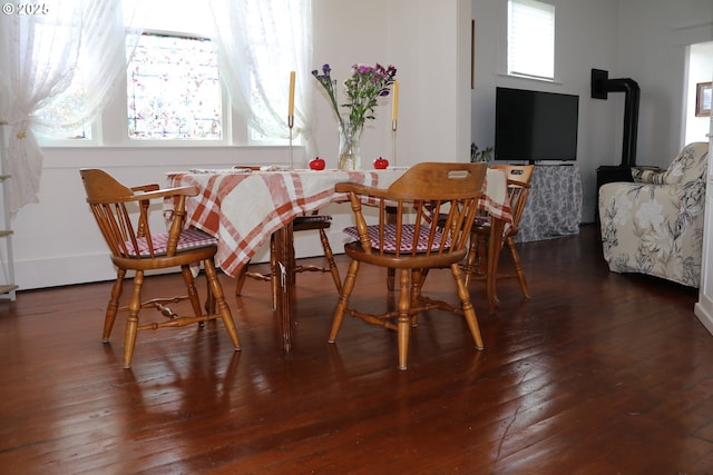 530 SE Marlin Ave, Warrenton, OR 97146 - dining space with wood-type flooring and a wood stove