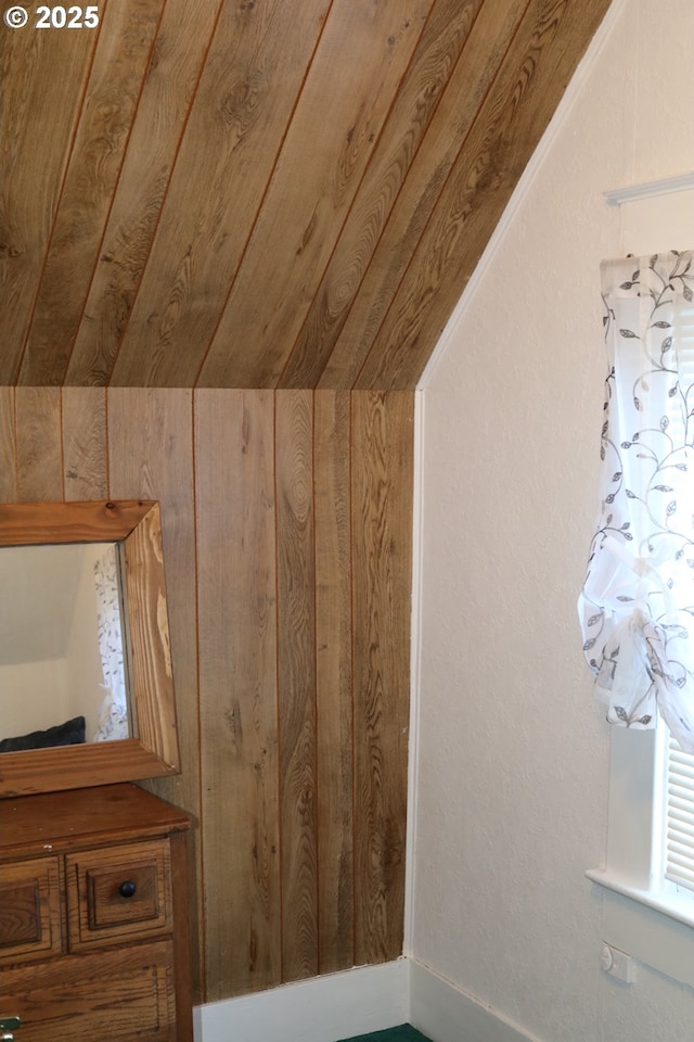 bonus room with lofted ceiling, wooden walls, and wooden ceiling