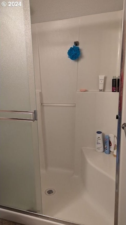 bathroom with an enclosed shower